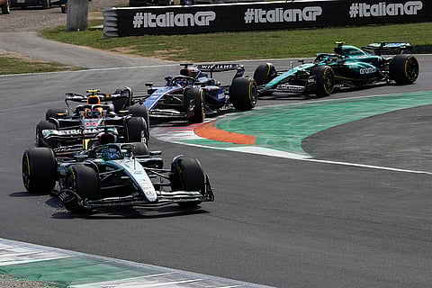 Italian Grand Prix 2024: Mercedes driver George Russell of Britain, left, steers his car